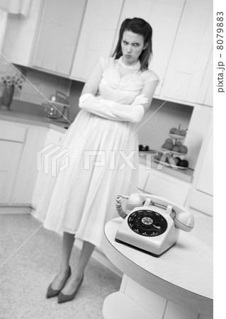Woman Waiting By Telephone Woman Waiting By Telephone 8079883