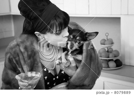 Woman Kisses a Dog 8079889
