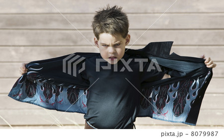 Boy opening his shirt 8079987