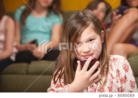 Little Girl Listens To Music 8080089