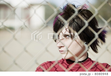 Punk Girl Behind Chain Link Punk Girl Behind Chain Link 8080948