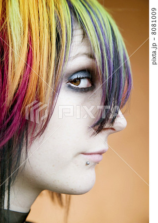 Alternative girl with multi-colred hair looks up 8081009