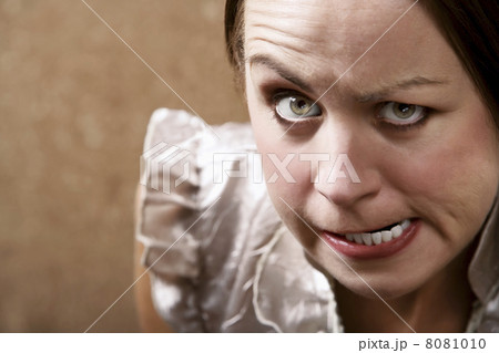 Glaring Young Woman 8081010