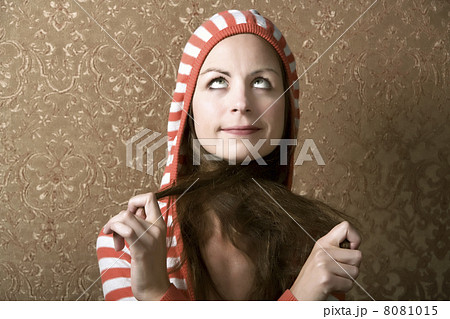 Young Woman Pulling on her Long Hair Young Woman Pulling on her Long Hair 8081015