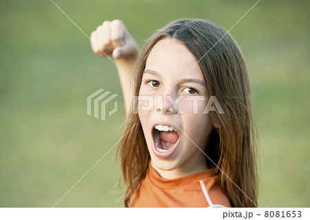 Boy with Long Hair Throws a Punch 8081653