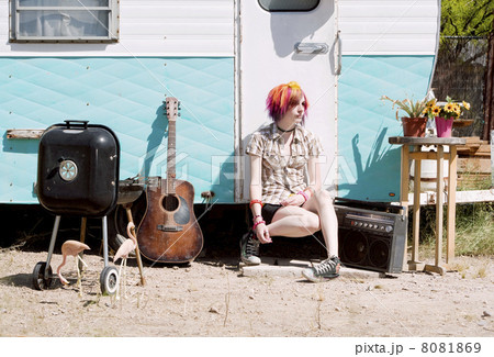 Girl Sitting on a Trailer Step Girl Sitting on a Trailer Step 8081869
