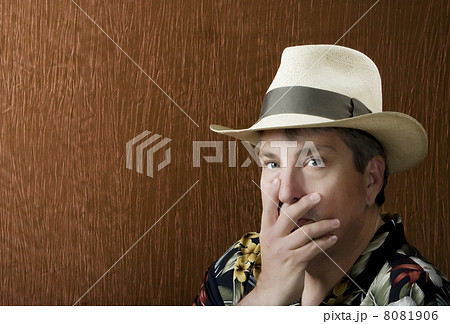 Man with his hand in front of hise face 8081906