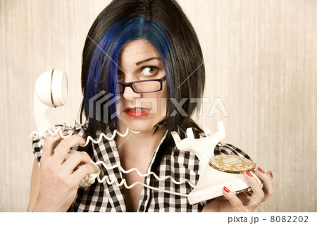 Pretty young woman wrapped in a phone cord 8082202