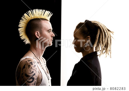 Man with Mohawk and Woman with Dreadlocks 8082283