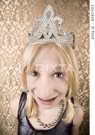 Pretty young girl with a tiara with braces Pretty young girl with a tiara with braces 8082403