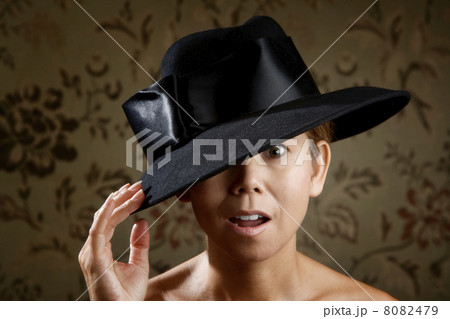 Ethnic woman in a black hat 8082479