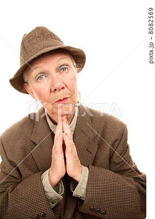 Senior woman in male clothes giving blessing 8082569