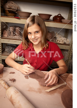 Young girl working in clay studio Young girl working in clay studio 8082653