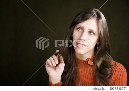 Pretty Young Woman Biting Her Lip 8083007