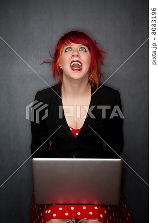 Punky Girl with Red Hair with Laptop Computer 8083196
