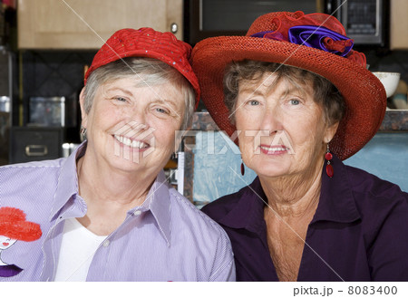 Two Senior Women Wearing Red Hats Two Senior Women Wearing Red Hats 8083400