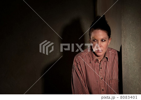Frightened woman in hallway 8083401