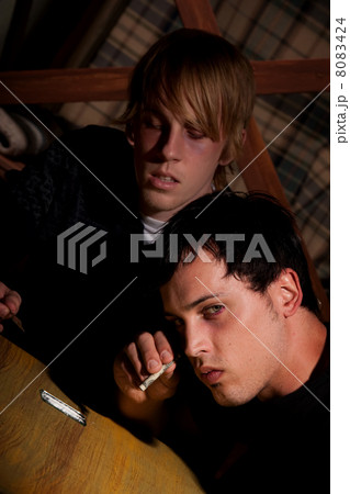 Two young men with heroin or cocaine 8083424
