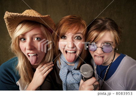 Three Young Girls with Microphone and Tongues Out 8083953