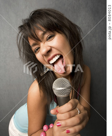 Beautiful Young Singer Sticking Out Her Tongue 8084013