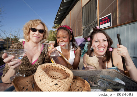 Three women drinking alcohol 8084093