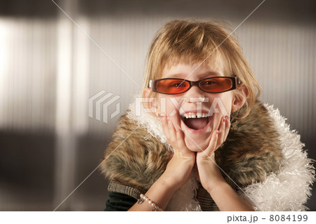 Cute young girl in red glasses Cute young girl in red glasses 8084199