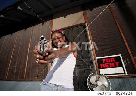 Woman with Gun 8084323