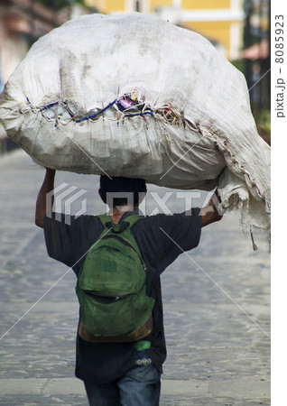 Nicaraguan man with a large burden Nicaraguan man with a large burden 8085923