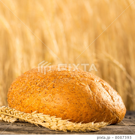 Homemade bread and wheat on the wooden table Homemade bread and wheat on the wooden table 8087393