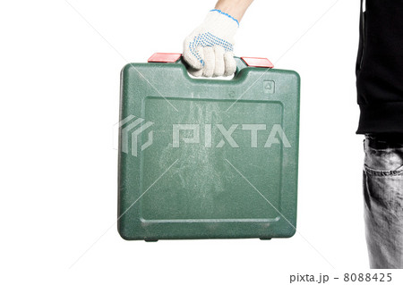 Green tool box in workers hand Green tool box in workers hand 8088425