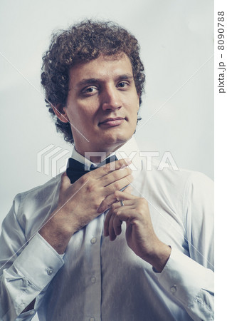 Funny businessman showing OK sign on gray studio shot Funny businessman showing OK sign on gray studio shot 8090788