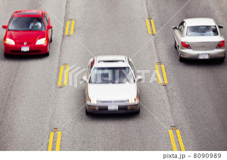 Cars Speeding Along Highway Cars Speeding Along Highway 8090989
