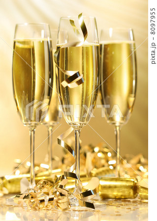 Glasses of golden champagne Glasses of golden champagne 8097955