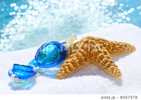 Blue goggles on a white towel 8097978