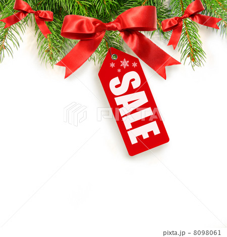 Pine branches,bows and sales tag isolated on white Pine branches,bows and sales tag isolated on white 8098061