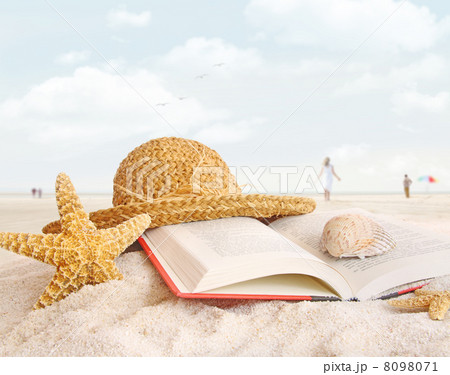 Straw hat , book and seashells in the sand 8098071