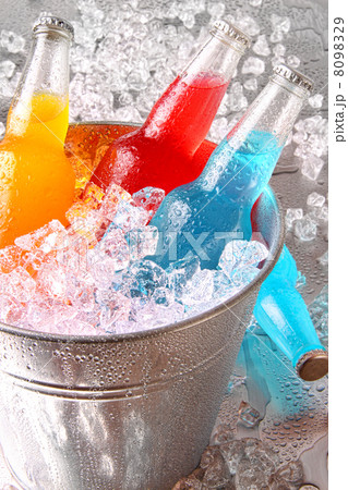 Bottles of cooler drinks with ice 8098329