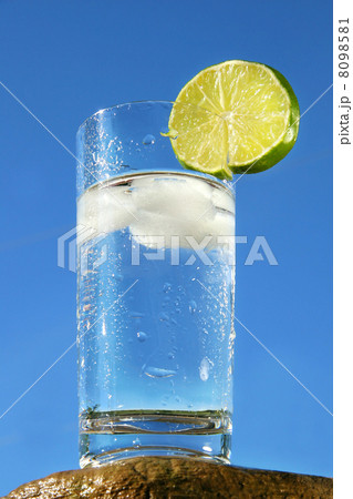 Cold glass of water against a blue sky Cold glass of water against a blue sky 8098581