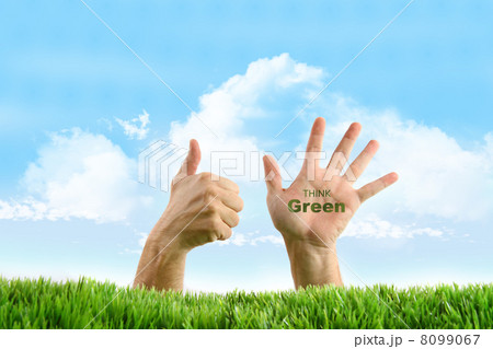 Hands with eco friendly sign in the grass 8099067