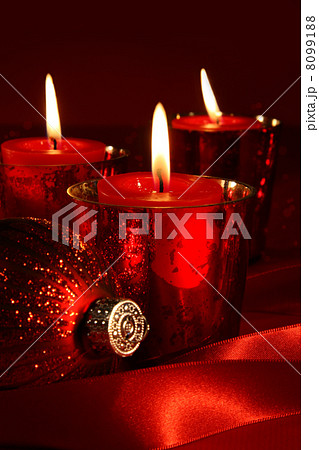 Red candles with ribbons Red candles with ribbons 8099188