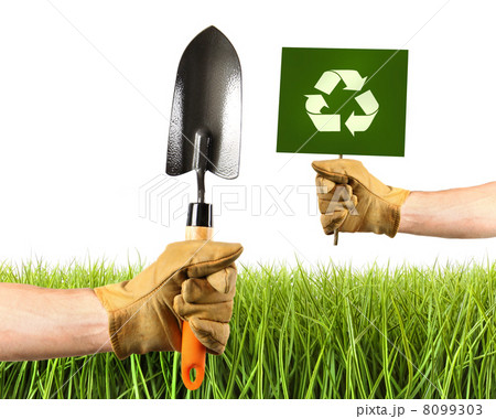 Hands holding garden trowel and sign Hands holding garden trowel and sign 8099303