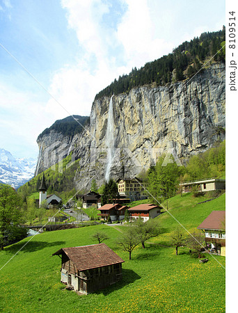mountain village with church and waterfall, Alps, Switzerland . mountain village with church and waterfall, Alps, Switzerland . 8109514