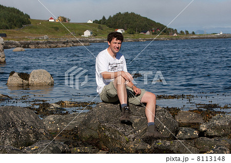Man at the coastline of Runde Island (Norway) Man at the coastline of Runde Island (Norway) 8113148