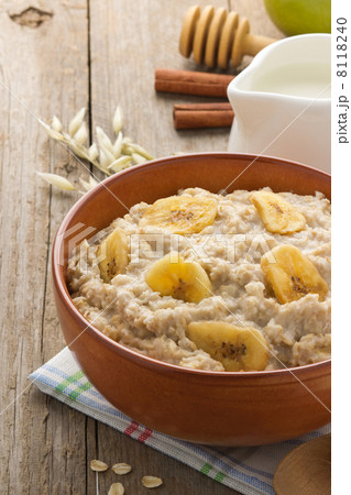 bowl of oatmeal on wood bowl of oatmeal on wood 8118240
