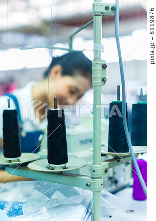 Indonesian seamstress in a textile factory Indonesian seamstress in a textile factory 8119876