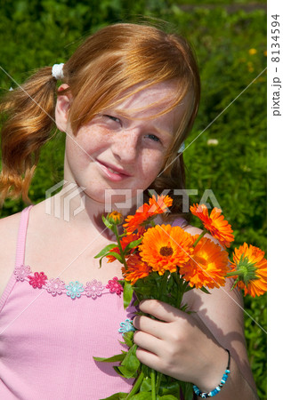 Girl is plucking marigolds 8134594