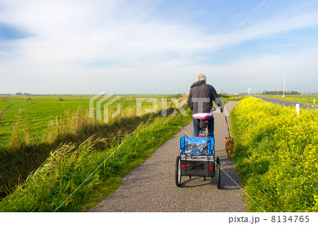Man with his dog at the bike 8134765