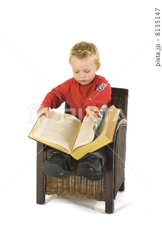 Little boy with heavy book Little boy with heavy book 8135147