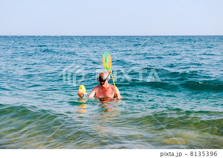Man is snorkeling Man is snorkeling 8135396