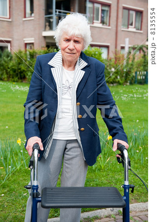 Elderly woman with walker Elderly woman with walker 8135554